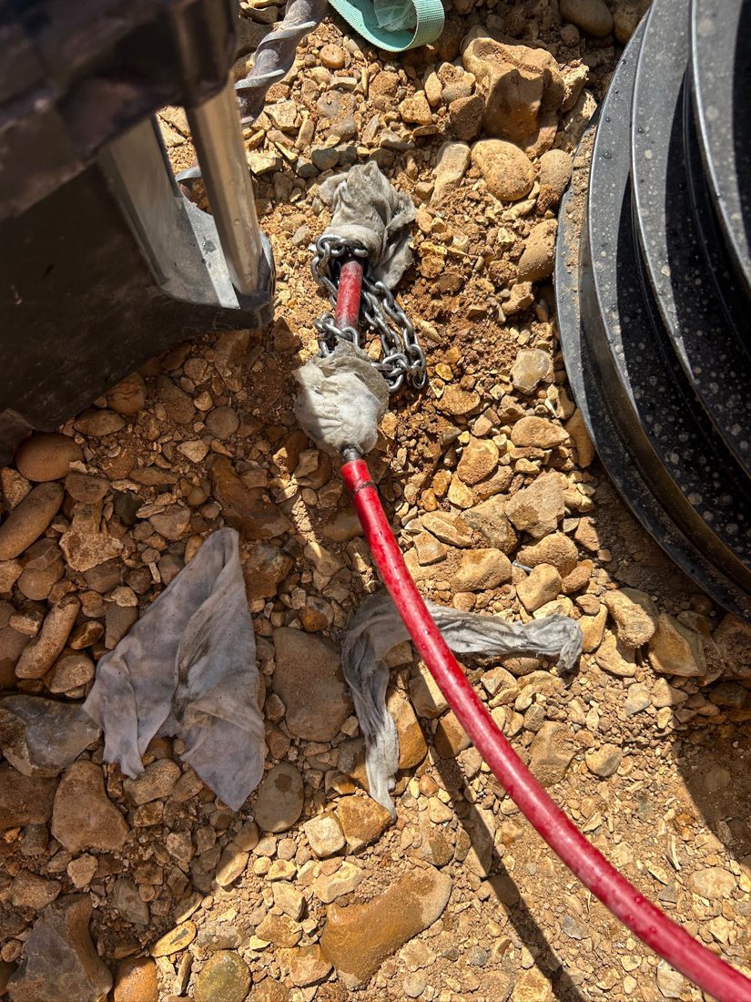 Wet wipes wrapped around the chain cutting head of a flex shaft machine.